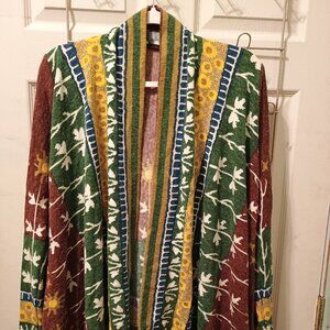 Three medium size sweaters